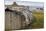 Upturned Weathered Boat Hut with Lindisfarne Castle and Fishing Boats at Low Tide, Holy Island-Eleanor Scriven-Mounted Photographic Print