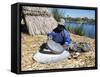 Uros (Urus) Woman Grinding Corn, Islas Flotantas, Reed Islands, Lake Titicaca, Peru, South America-Tony Waltham-Framed Stretched Canvas