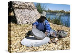 Uros (Urus) Woman Grinding Corn, Islas Flotantas, Reed Islands, Lake Titicaca, Peru, South America-Tony Waltham-Stretched Canvas