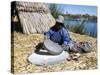 Uros (Urus) Woman Grinding Corn, Islas Flotantas, Reed Islands, Lake Titicaca, Peru, South America-Tony Waltham-Stretched Canvas