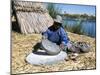 Uros (Urus) Woman Grinding Corn, Islas Flotantas, Reed Islands, Lake Titicaca, Peru, South America-Tony Waltham-Mounted Photographic Print