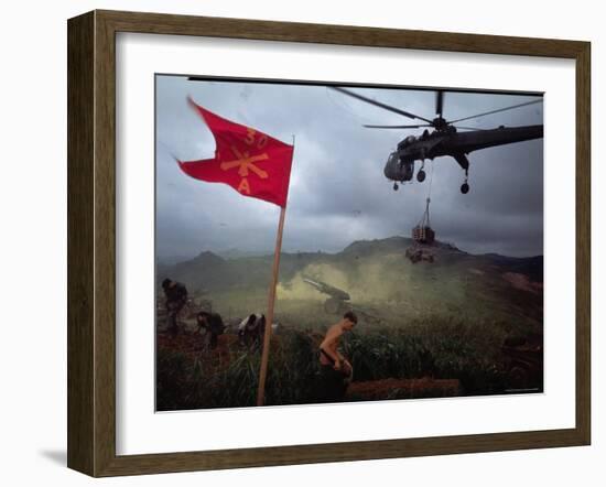 US 1st Air Cavalry Skycrane Helicopter Delivering Ammunition and Supplies to Besieged Marines-Larry Burrows-Framed Photographic Print