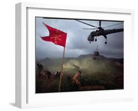 US 1st Air Cavalry Skycrane Helicopter Delivering Ammunition and Supplies to Besieged Marines-Larry Burrows-Framed Photographic Print