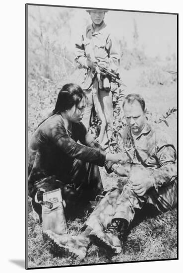 US Air Force Pilot Is Given First Aid by North Vietnam Captors in Jan. 1966-null-Mounted Photo