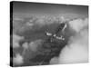 US Army's Ryan, Dragonfly, YO-51 Observation Plane Soaring Above the Clouds-Peter Stackpole-Stretched Canvas