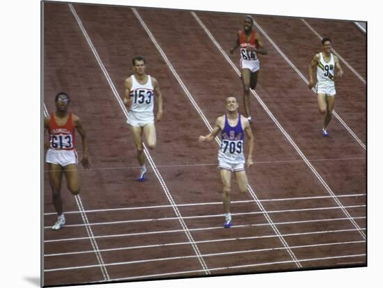 US Athlete Michael Larrabee Winning the 400 Meters at the Summer Olympics-George Silk-Mounted Premium Photographic Print