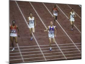 US Athlete Michael Larrabee Winning the 400 Meters at the Summer Olympics-George Silk-Mounted Premium Photographic Print