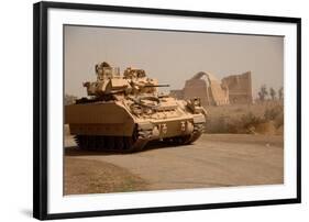 US Bradley Fighting Vehicle Passes by the Palace of Historic Ctesiphon, Feb. 16, 2008-null-Framed Photo