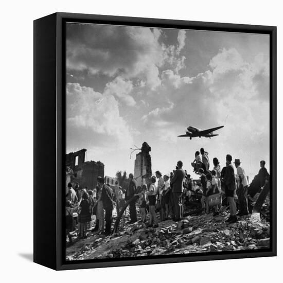 US C-47 Cargo Plane Flying over Ruins, Approaching Tempelhof Airport with Food and Supplies-Walter Sanders-Framed Stretched Canvas