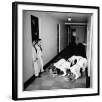 US Coast Guard Academy, Lower Classmen Bowing over Books, Hoping for Luck in Examinations-William C^ Shrout-Framed Photographic Print