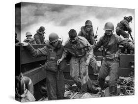 US Coast Guardsmen Assisting a Wounded Marine Returning from the Fight on Iwo Jima-null-Stretched Canvas