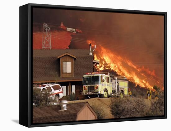 US Forest Service Air Tanker Drops Fire Retardant as the Fire Burns in the Hills Above a Home-null-Framed Stretched Canvas