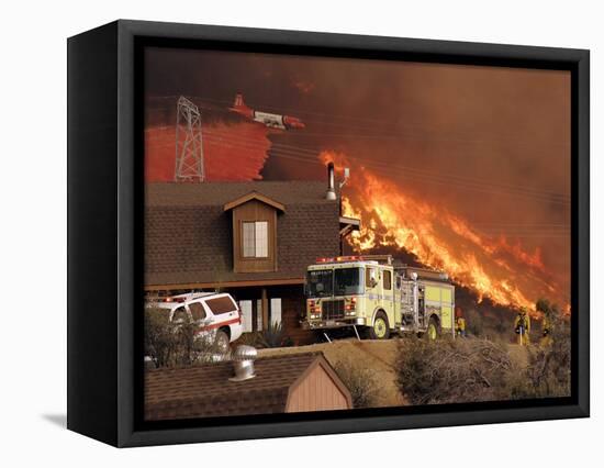 US Forest Service Air Tanker Drops Fire Retardant as the Fire Burns in the Hills Above a Home-null-Framed Stretched Canvas