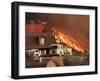 US Forest Service Air Tanker Drops Fire Retardant as the Fire Burns in the Hills Above a Home-null-Framed Photographic Print