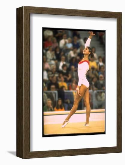 US Gymnast Ludmila Turishcheva Performing a Floor Exercise at the Summer Olympics-John Dominis-Framed Photographic Print