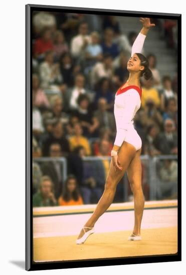 US Gymnast Ludmila Turishcheva Performing a Floor Exercise at the Summer Olympics-John Dominis-Mounted Photographic Print