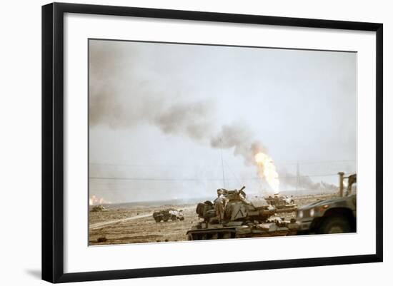 US Marine Following the Retreat of Iraqi Forces from Kuwait, Feb 27, 1991-null-Framed Photo