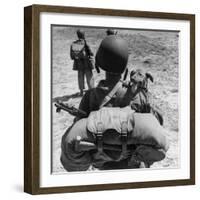 US Marine Jesse Goin Carrying His Dog Towards the Front During the Fighting on Kwajalein-George Strock-Framed Photographic Print