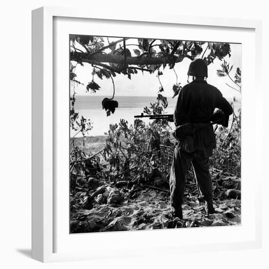 US Marine Looking at Bodies of Dead Japanese Soldiers Killed During Battle For Control of Saipan-W^ Eugene Smith-Framed Photographic Print