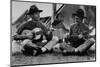 US Marine Sitting on Ground and Playing Guitar-null-Mounted Photographic Print