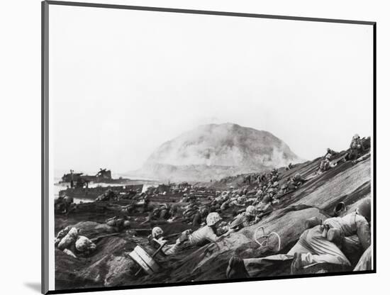US Marines Advance Up Black Sand Beaches of Iwo Jima to Engage Japanese Troops-Louis R. Lowery-Mounted Photographic Print