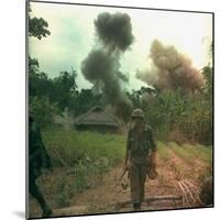 US Marines Walk Away from Blown Up Viet Cong Base, May 1966-null-Mounted Photo