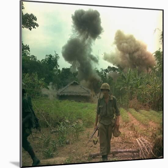 US Marines Walk Away from Blown Up Viet Cong Base, May 1966-null-Mounted Photo