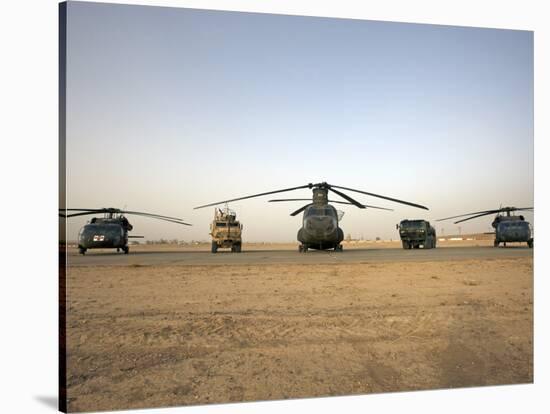 US Military Vehicles and Aircraft Lined Up on the Taxiway at Camp Speicher, Iraq-null-Stretched Canvas