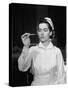 US Navy Nurse in Uniform Reading a Thermometer-null-Stretched Canvas