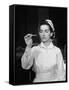 US Navy Nurse in Uniform Reading a Thermometer-null-Framed Stretched Canvas