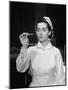 US Navy Nurse in Uniform Reading a Thermometer-null-Mounted Photographic Print