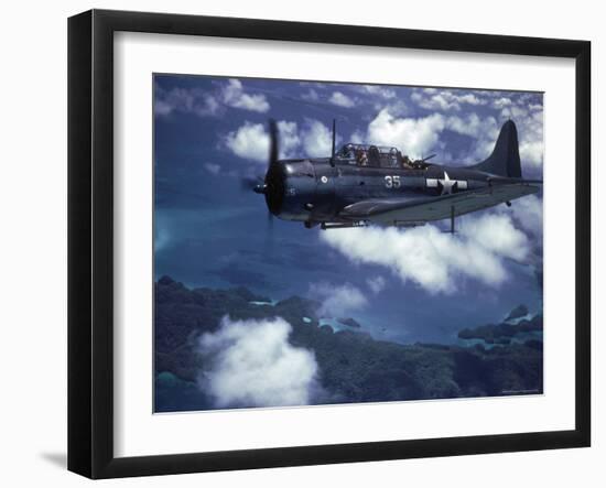 US Navy SBD Dauntless in Flight During Palau Islands Air Raid Attack-J^ R^ Eyerman-Framed Photographic Print