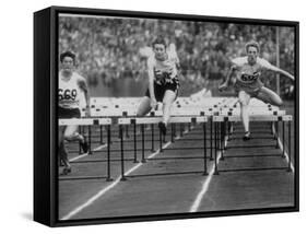 US Runner Fanny Blankers Koen Setting Olympic Record of 11.2 Seconds in 80 Meter Hurdles-Mark Kauffman-Framed Stretched Canvas