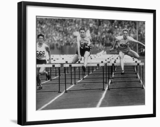 US Runner Fanny Blankers Koen Setting Olympic Record of 11.2 Seconds in 80 Meter Hurdles-Mark Kauffman-Framed Premium Photographic Print