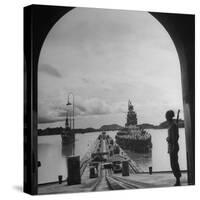 US Soldier Standing Guard over Section of Panama Canal, Battleship with Full Crew on Deck-Thomas D^ Mcavoy-Stretched Canvas