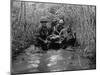 US Soldiers Carry a Wounded Comrade Through a Swampy Area in Vietnam, 1969-null-Mounted Photo