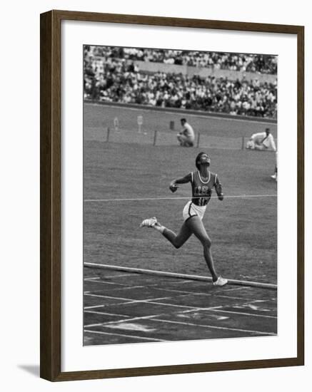 US Sprinter, Wilma Rudolph, Winning Women's 100 Meter Dash in Olympics-George Silk-Framed Premium Photographic Print