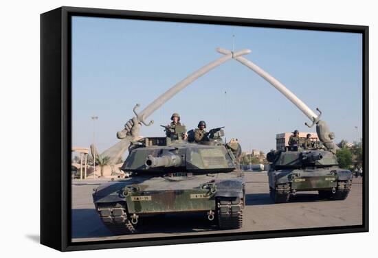 US Tanks Drive under the 'Hands of Victory' in Baghdad, Iraq, Ca. 2003-null-Framed Stretched Canvas