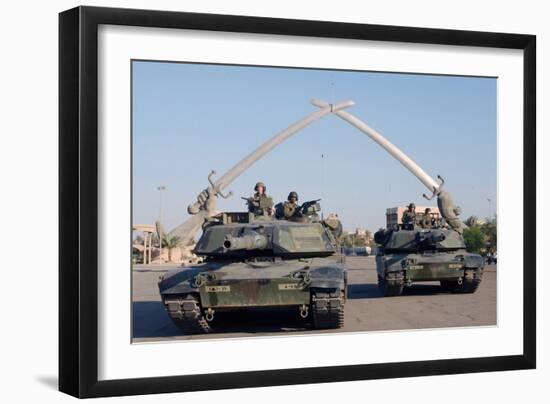 US Tanks Drive under the 'Hands of Victory' in Baghdad, Iraq, Ca. 2003-null-Framed Photo