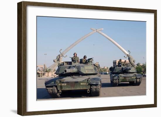 US Tanks Drive under the 'Hands of Victory' in Baghdad, Iraq, Ca. 2003-null-Framed Photo