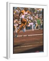 US Track Athlete Eddie Hart Running the 400 Meter Relay at the Summer Olympics-null-Framed Premium Photographic Print