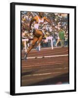 US Track Athlete Eddie Hart Running the 400 Meter Relay at the Summer Olympics-null-Framed Premium Photographic Print