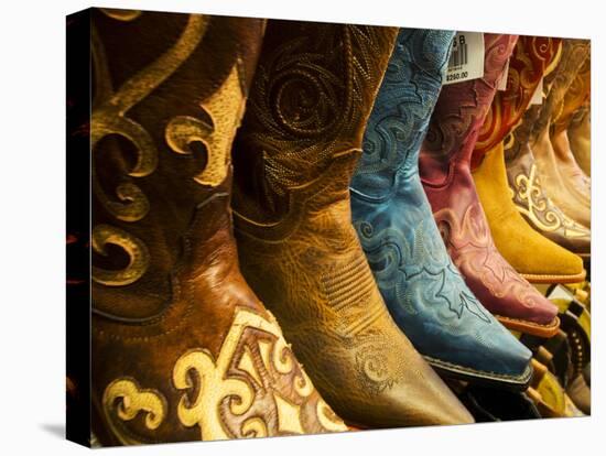 USA, Arizona, Old Scottsdale, Line Up of New Cowboy Boots-Terry Eggers-Stretched Canvas