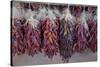 USA, Arizona, Sedona. Hanging dried chili peppers-Kevin Oke-Stretched Canvas