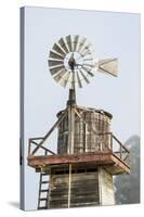 USA California. Cayucos, old wooden water tower with windmill for pumping-Alison Jones-Stretched Canvas