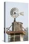 USA California. Cayucos, old wooden water tower with windmill for pumping-Alison Jones-Stretched Canvas