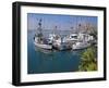 USA, California. Docked boats at Morro Bay with Morro Rock behind.-Anna Miller-Framed Premium Photographic Print