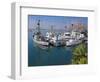 USA, California. Docked boats at Morro Bay with Morro Rock behind.-Anna Miller-Framed Photographic Print