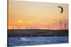 Usa, California, Rio Vista. Kiteboarder at sunset with wind farm turbines.-Merrill Images-Stretched Canvas