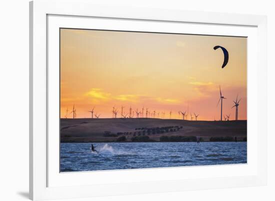 Usa, California, Rio Vista. Kiteboarder at sunset with wind farm turbines.-Merrill Images-Framed Photographic Print